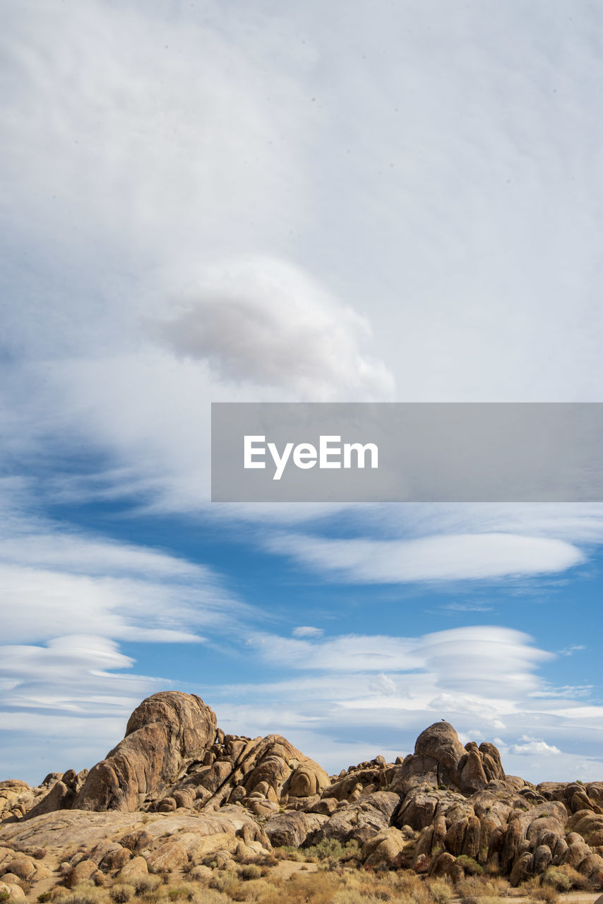 Rock formations on landscape against sky