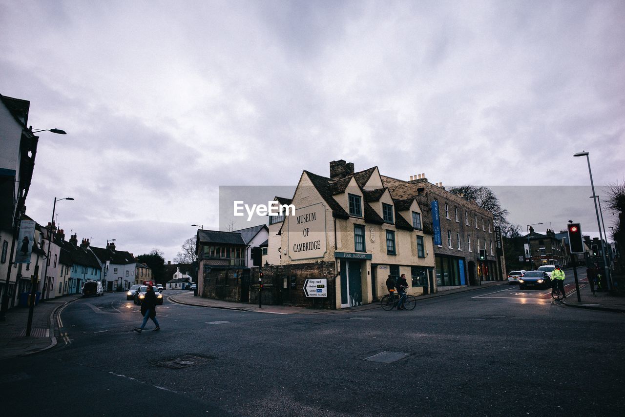 City street and buildings against sky