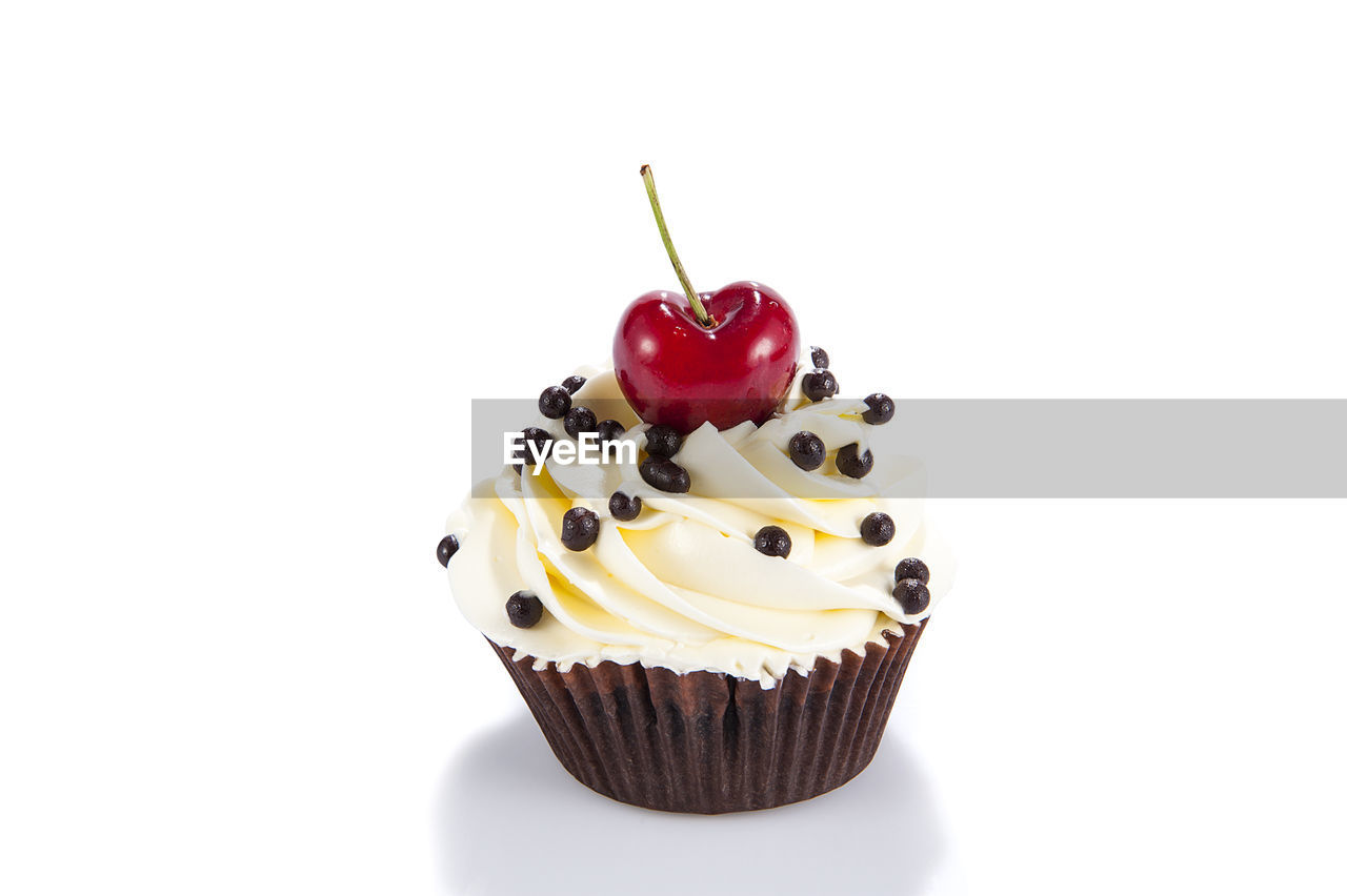 CLOSE-UP OF CUPCAKES ON WHITE BACKGROUND