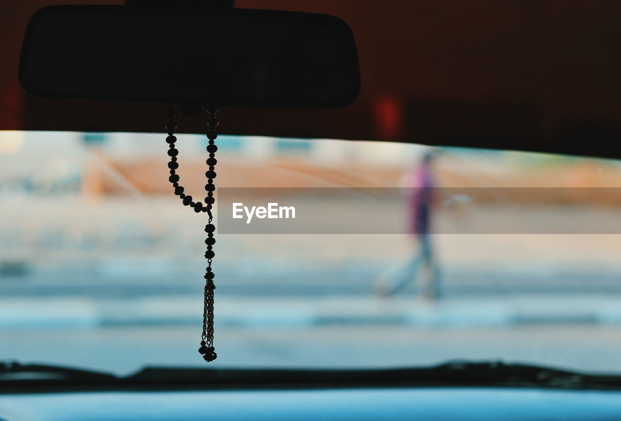 CLOSE-UP OF WATER DROPS ON CAR