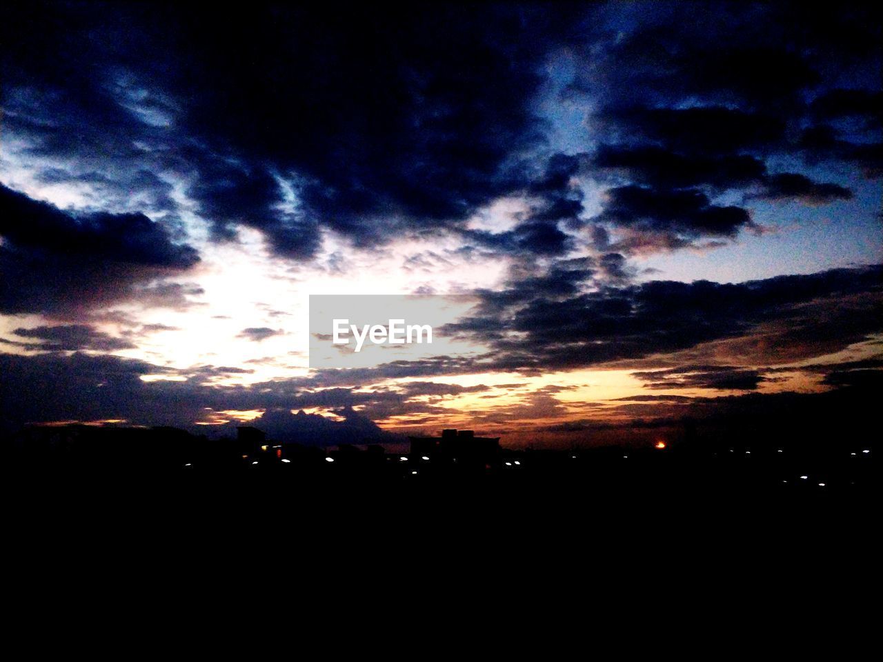 SCENIC VIEW OF SILHOUETTE LANDSCAPE AGAINST DRAMATIC SKY