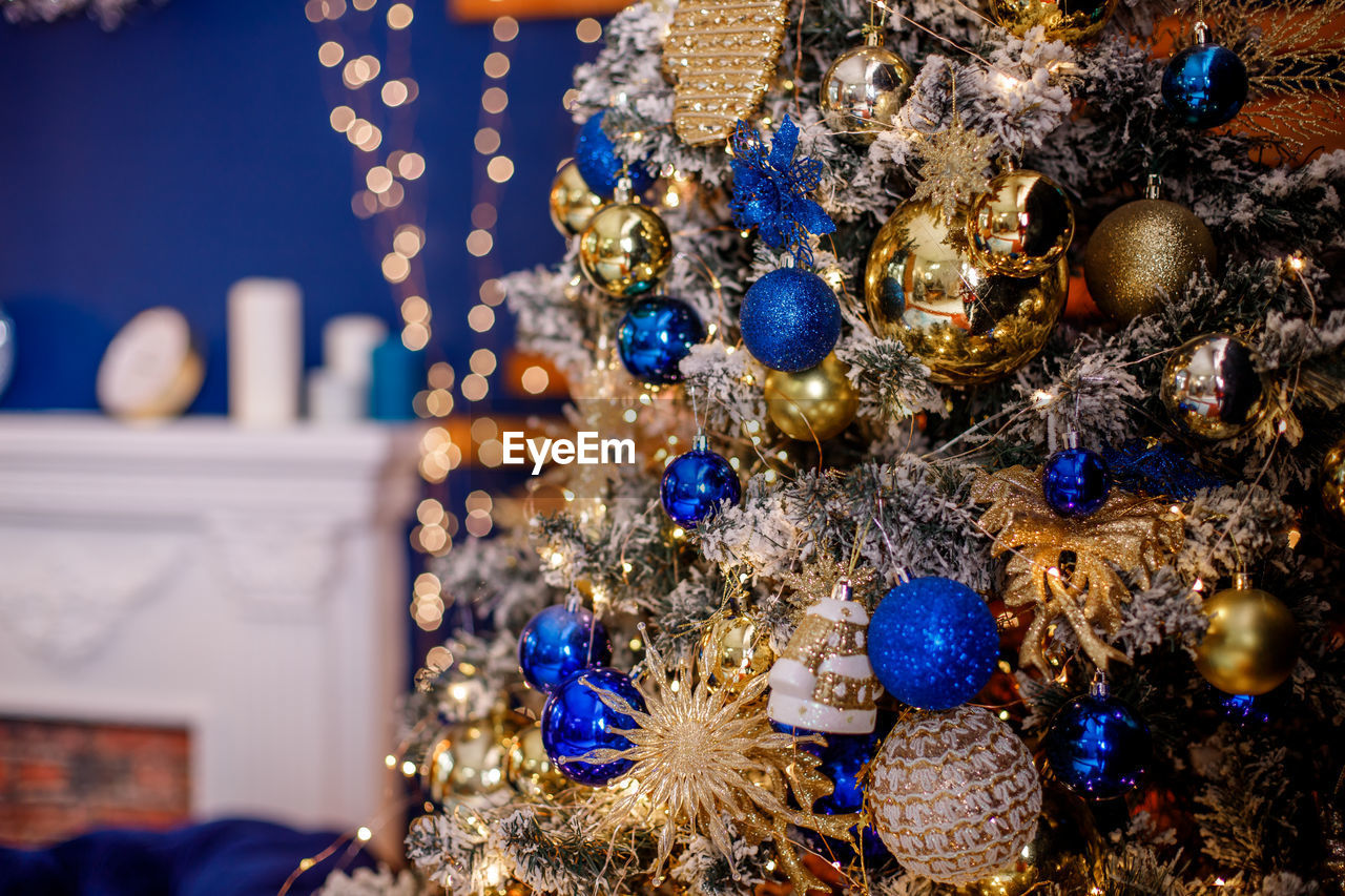 CLOSE-UP OF CHRISTMAS DECORATIONS ON BLUE FLOOR