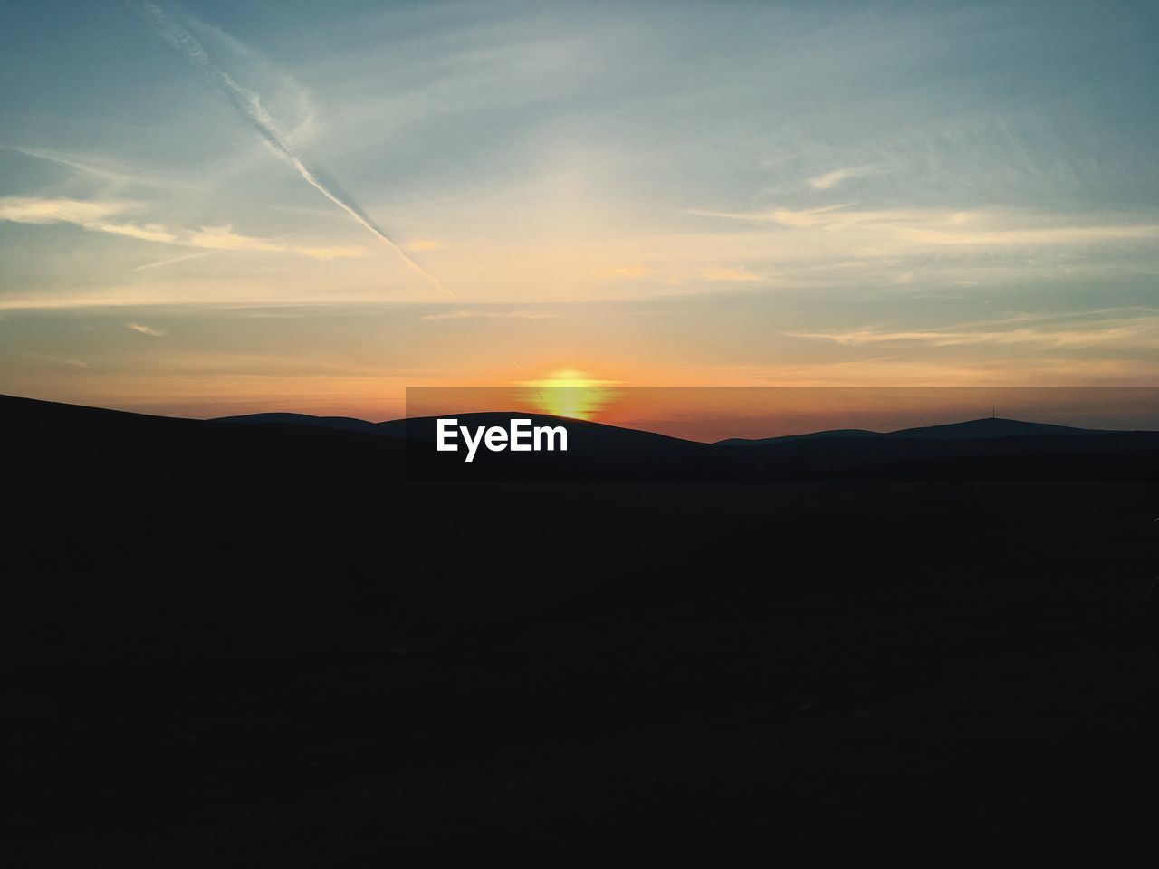 SILHOUETTE LANDSCAPE AGAINST SKY DURING SUNSET