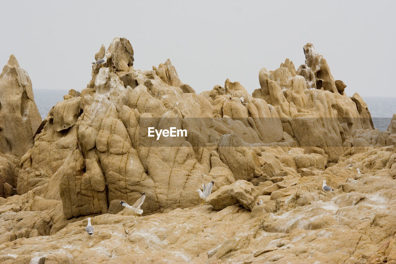 Rock formations against clear sky