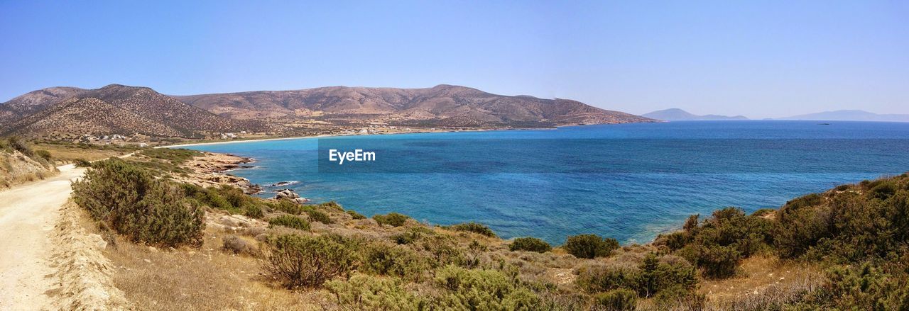 Scenic view of sea against clear blue sky