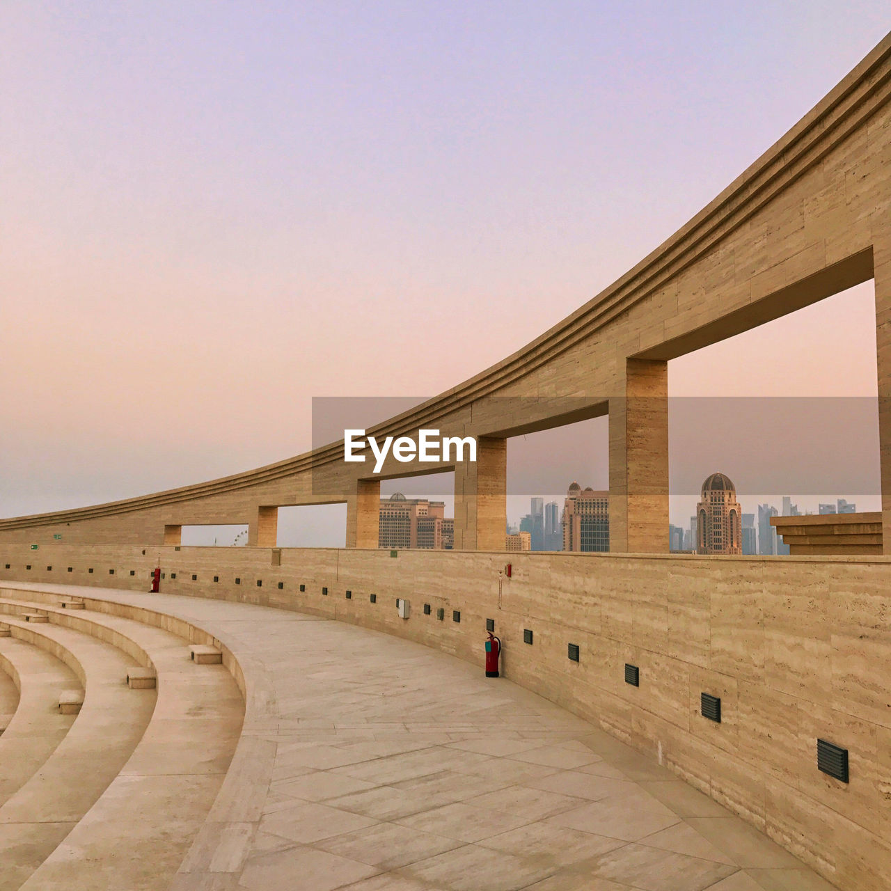 View of building against clear sky during sunset