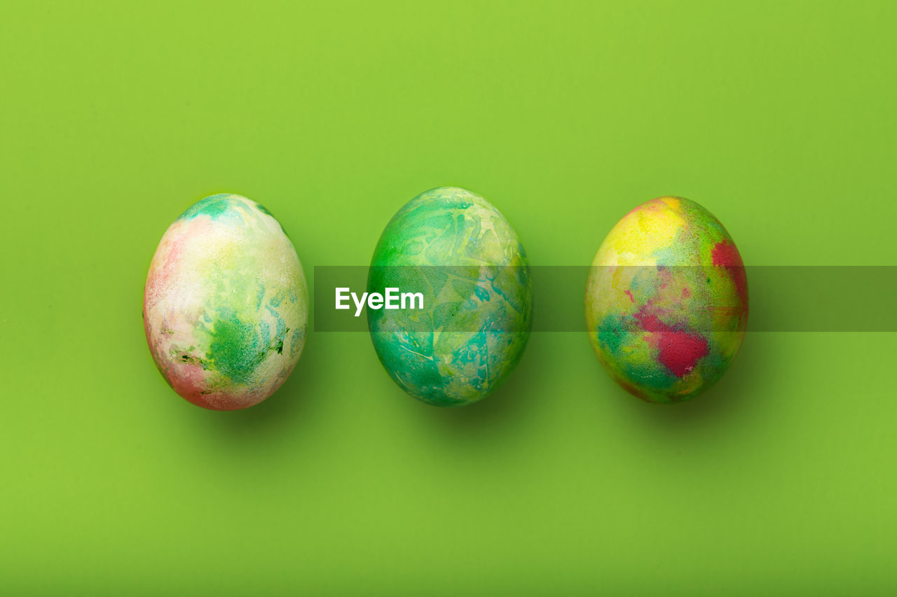 high angle view of easter egg against yellow background