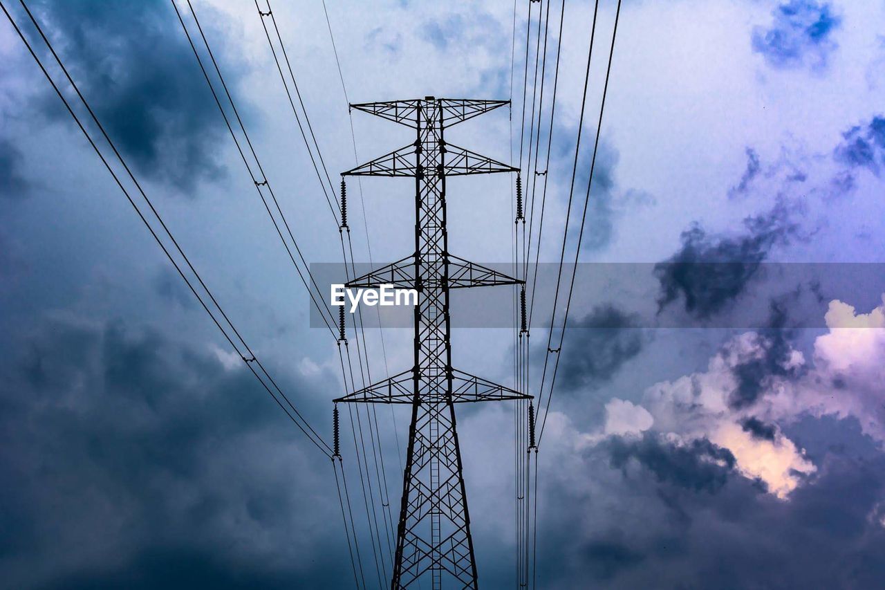 Low angle view of electricity pylon against sky