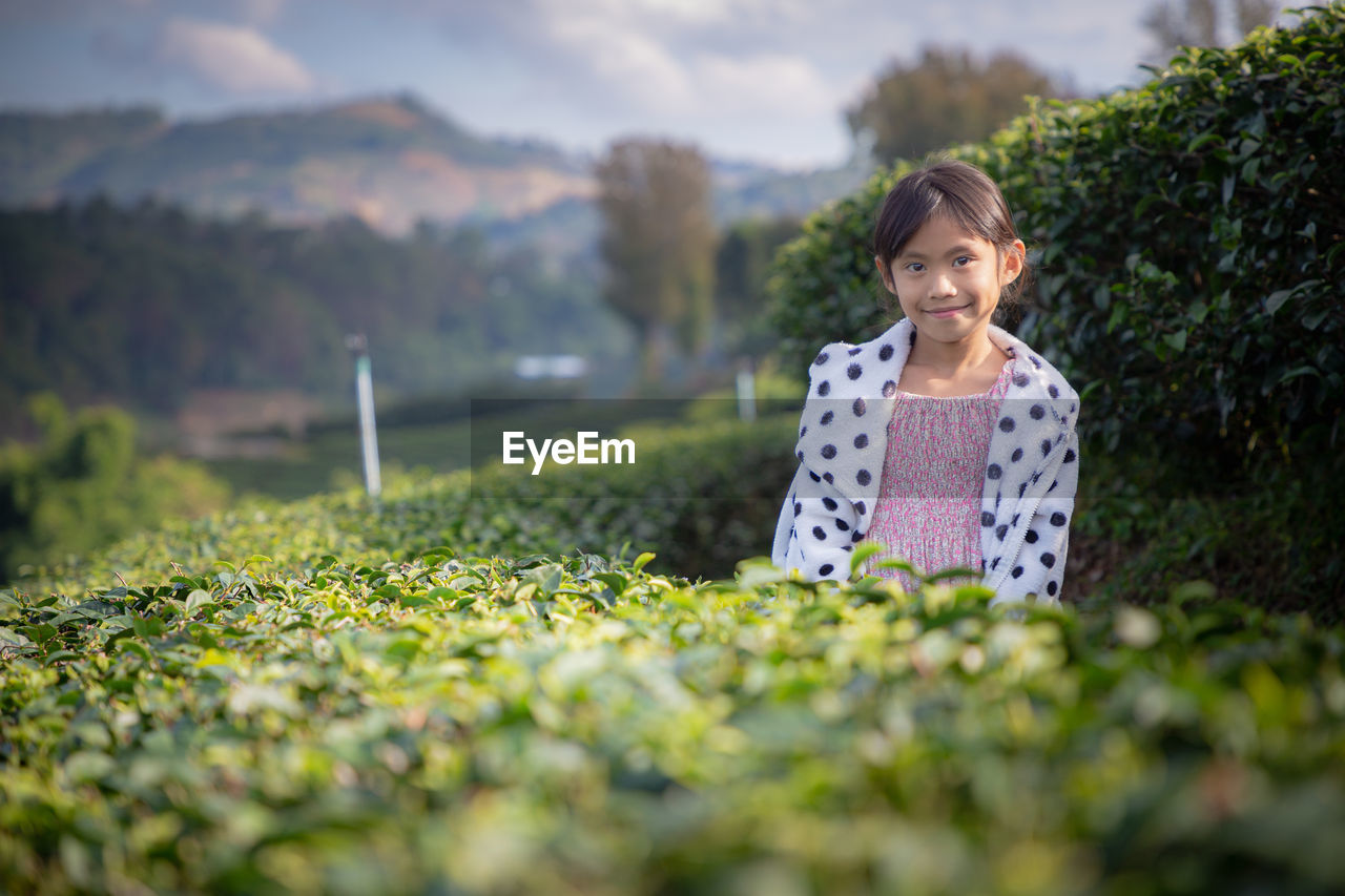 PORTRAIT OF A YOUNG WOMAN ON LAND