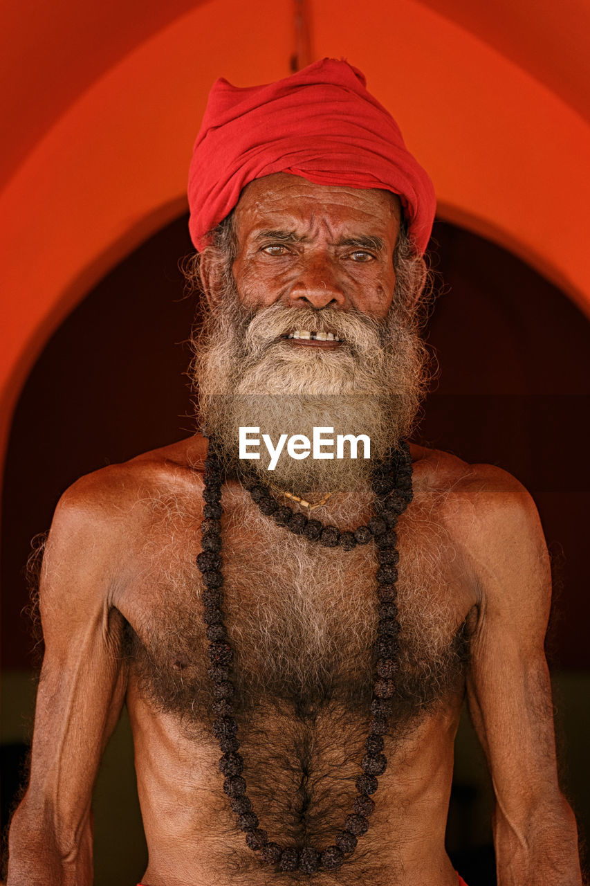 Portrait of shirtless mature bearded man