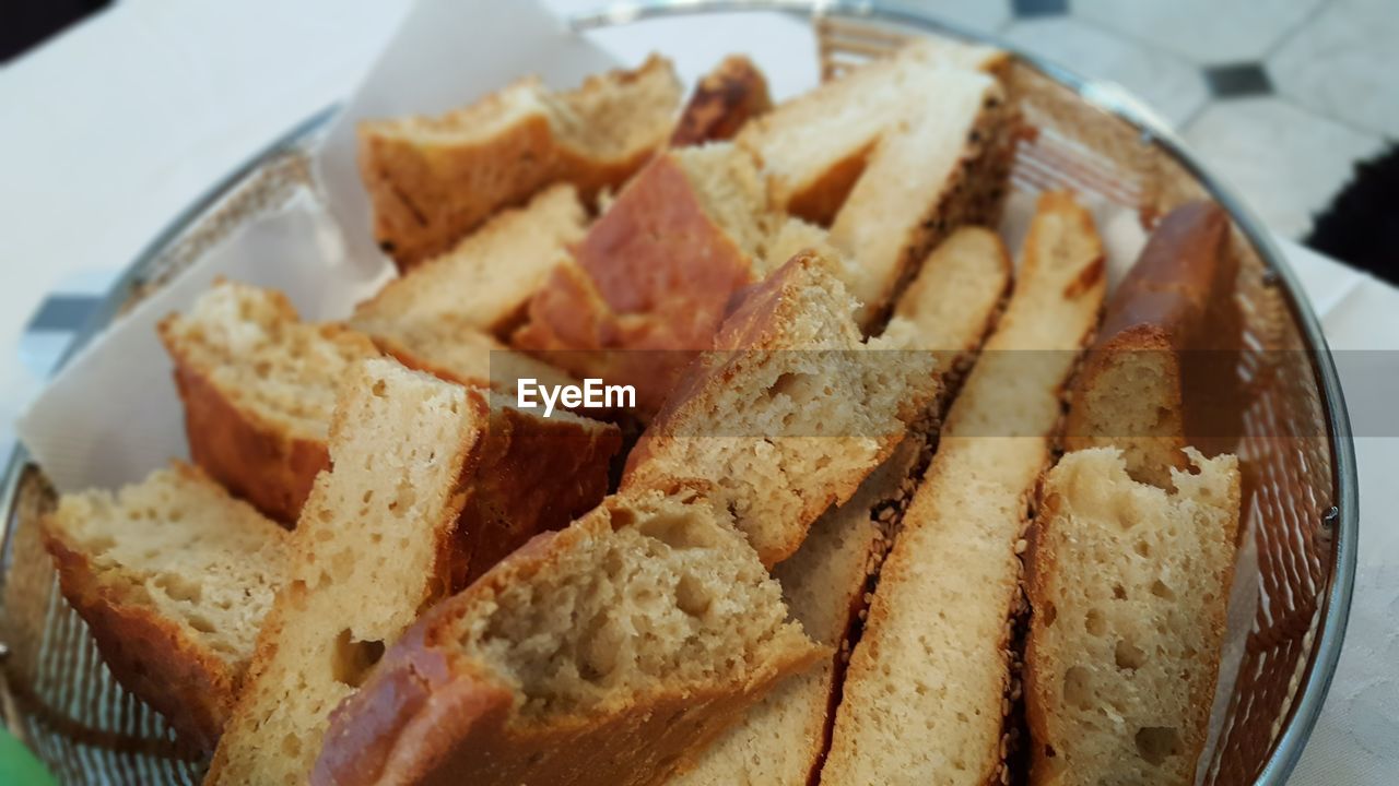 High angle view of fresh bread in basket on table