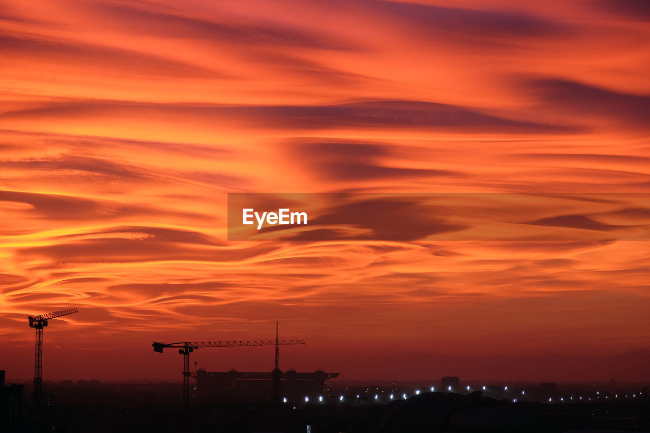 Spectacular autumn sunset with skyline of milan  and meazza stadium