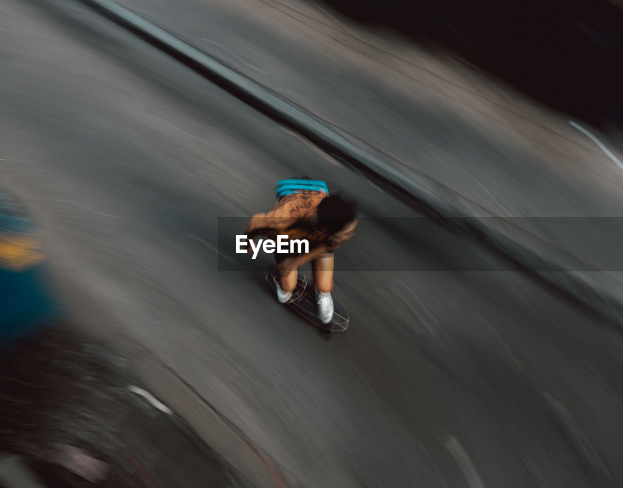 High angle view of man skateboarding on street