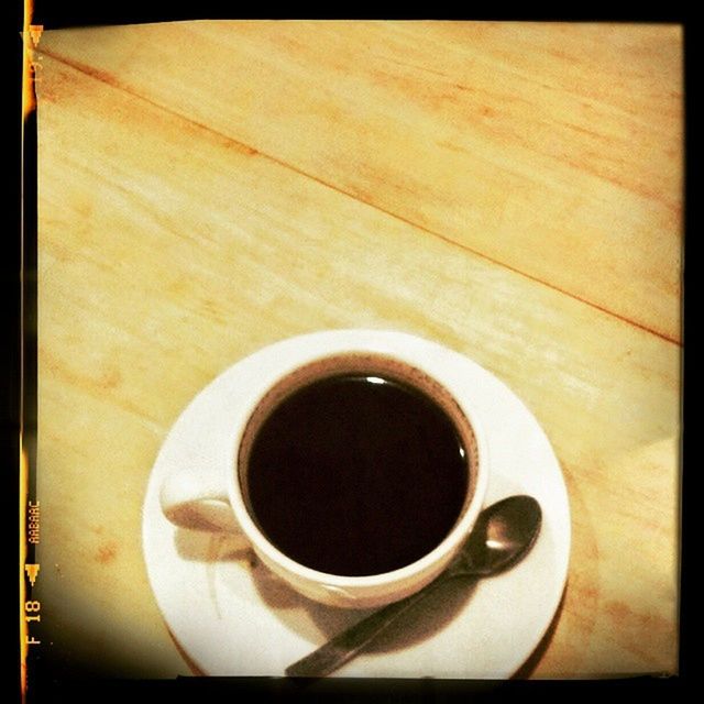 CLOSE-UP OF COFFEE CUP WITH COFFEE CUP