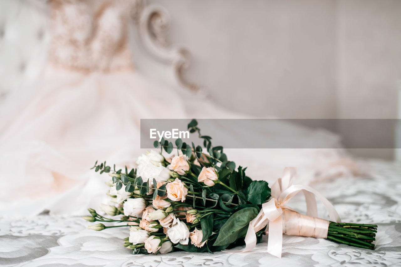 Close-up of wedding rings on table