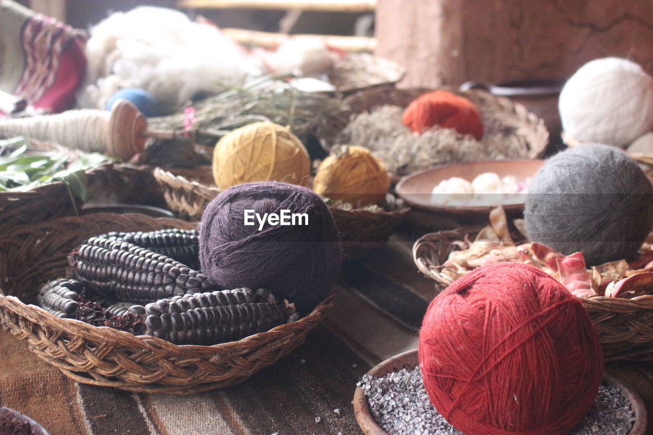 Close-up of colorful threads with food for sale at market