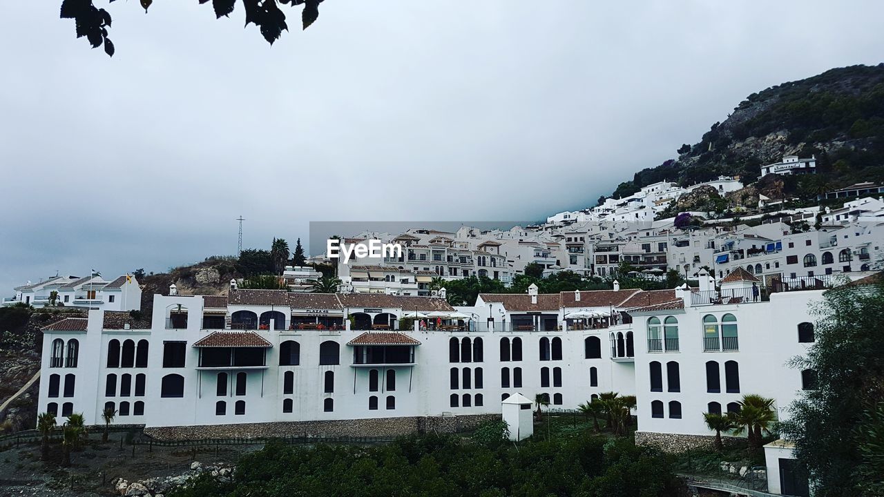 Buildings in city against sky