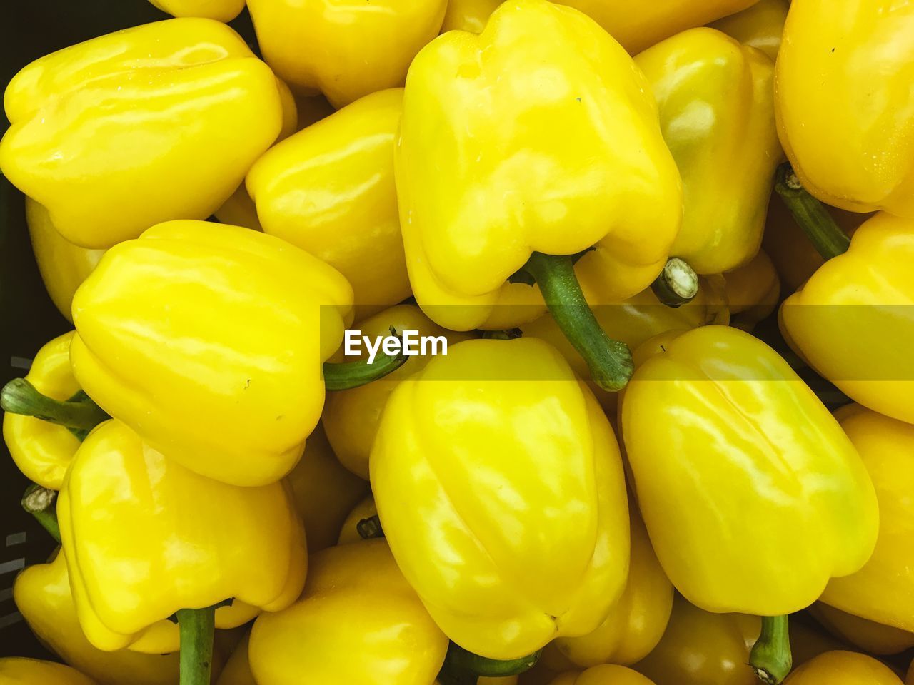FULL FRAME SHOT OF YELLOW BELL PEPPERS FOR SALE