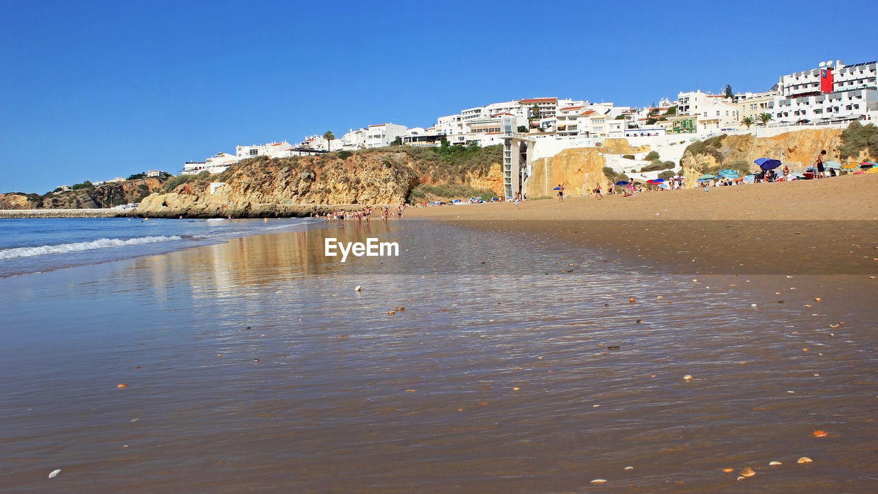 SCENIC VIEW OF BEACH AGAINST CLEAR SKY