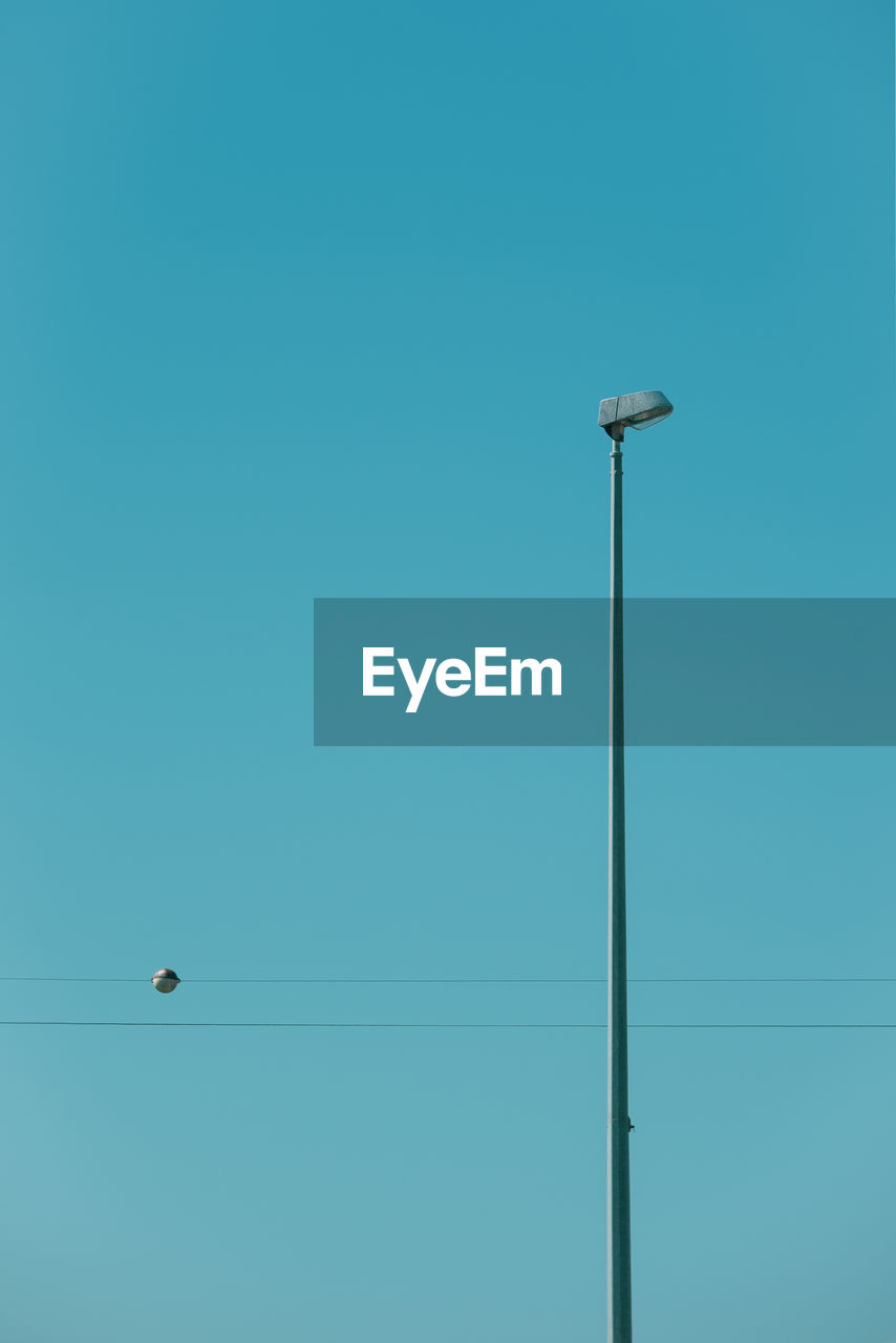 LOW ANGLE VIEW OF STREET LIGHT AGAINST SKY