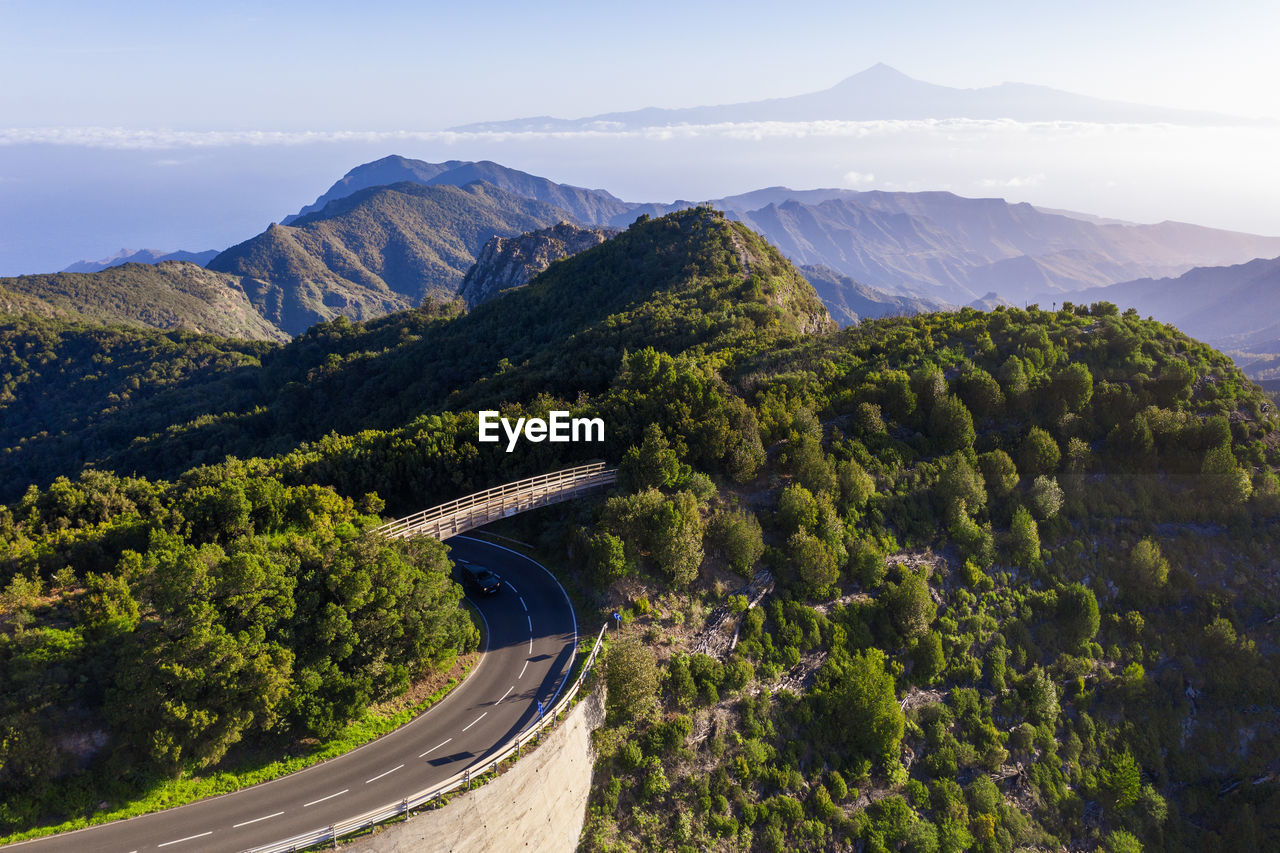 Drone view of bridge spanning over highway in garajonay national park