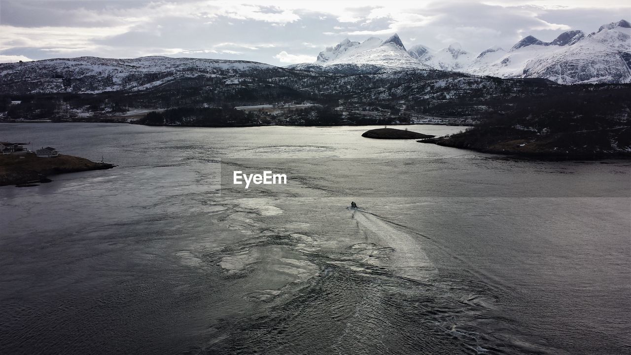 Scenic view of frozen lake against sky