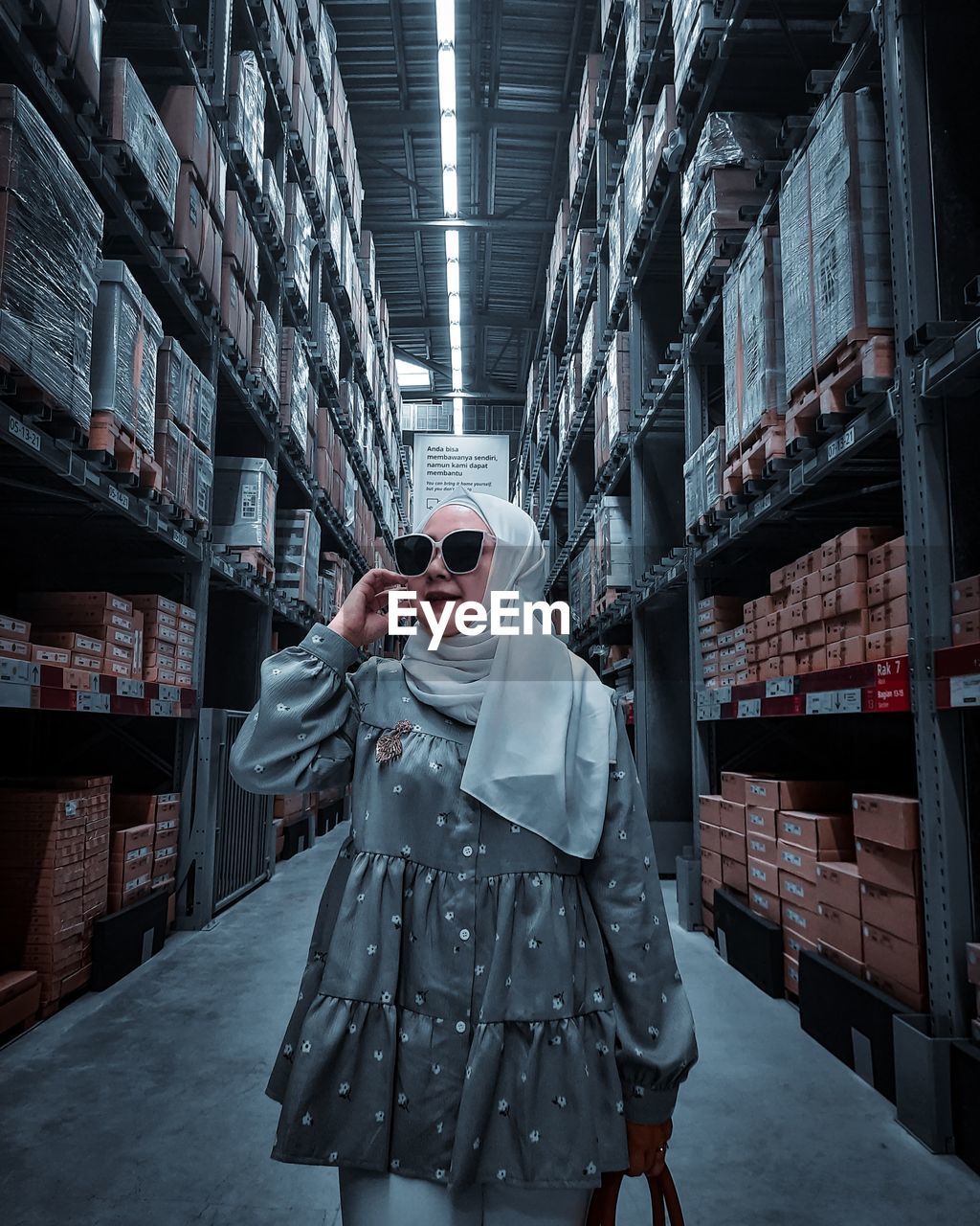 Portrait of woman standing in store