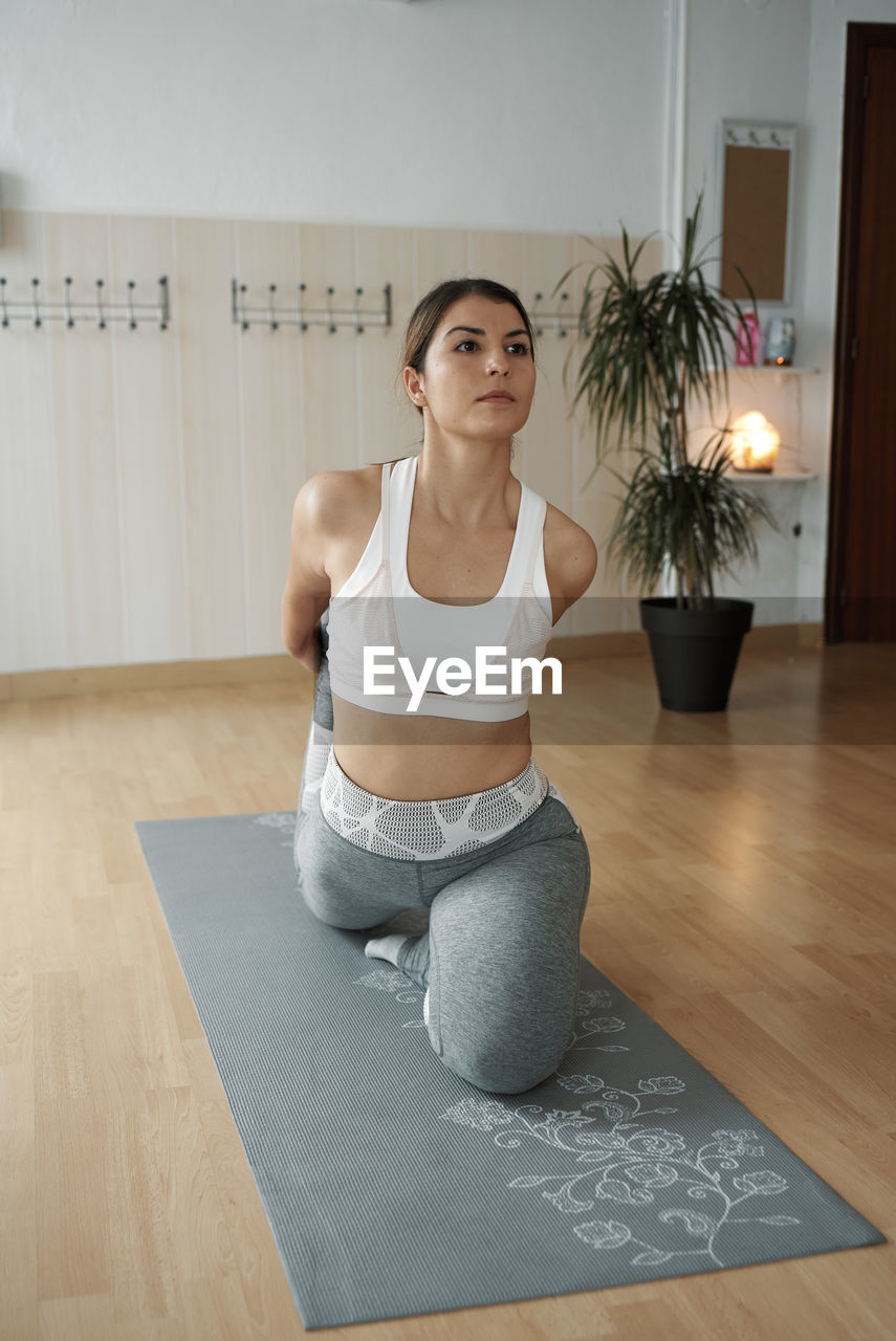 Group of women practicing pilates exercises in class