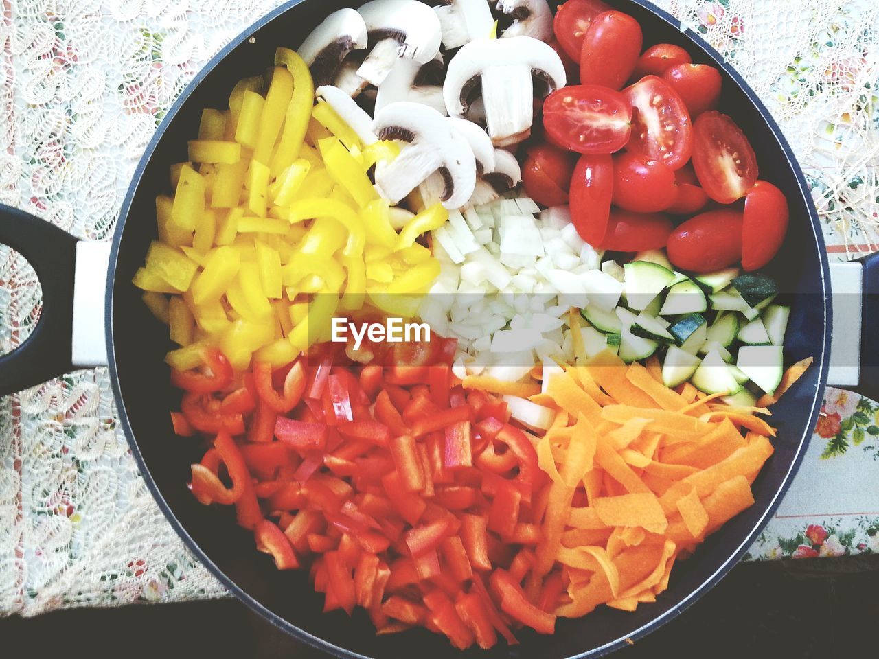 High angle view of vegetables chopped in container on table