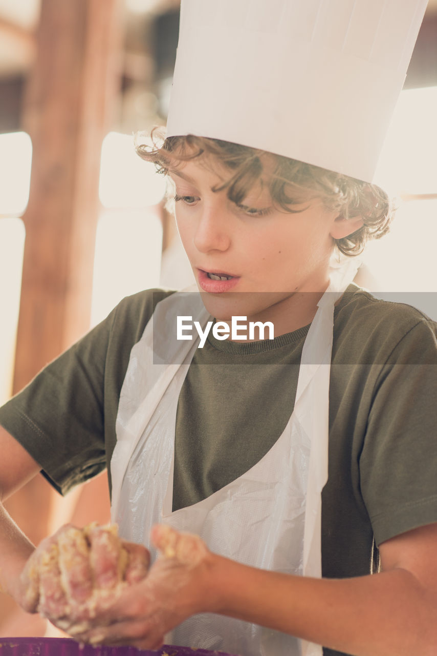 Portrait of boy baking