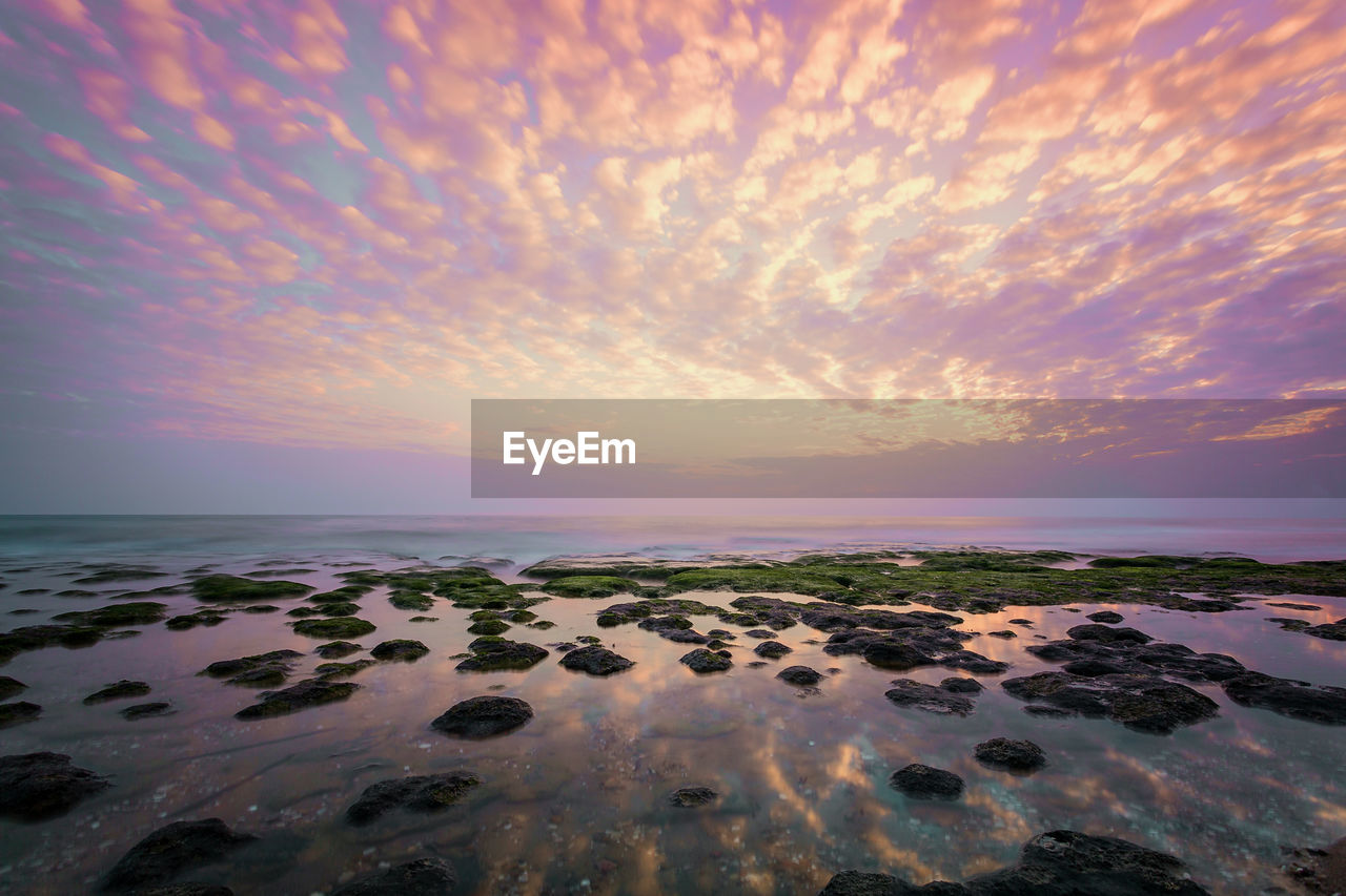 Scenic view of sea against sky at sunset