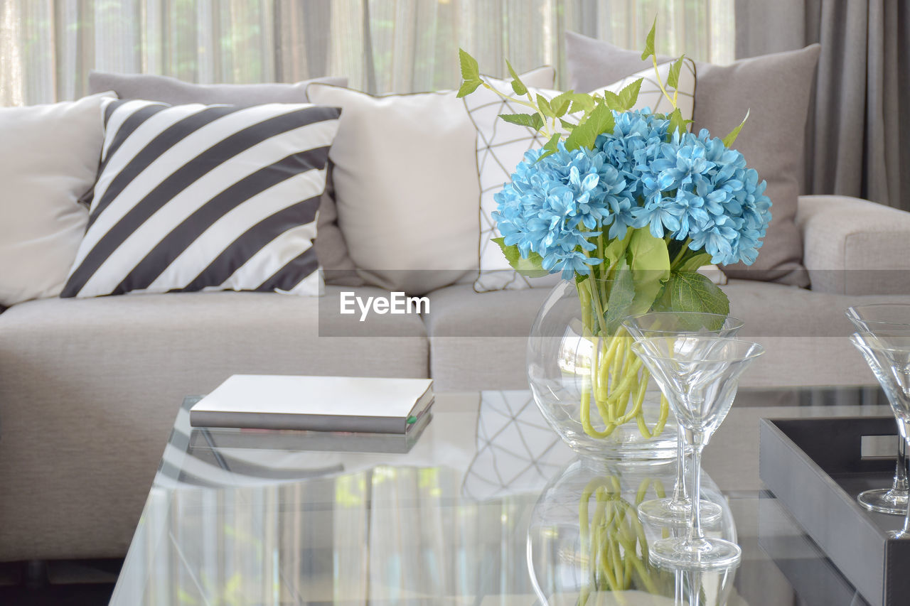 POTTED PLANTS ON TABLE AT HOME