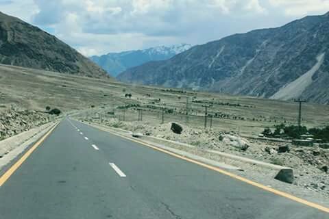 ROAD PASSING THROUGH MOUNTAINS