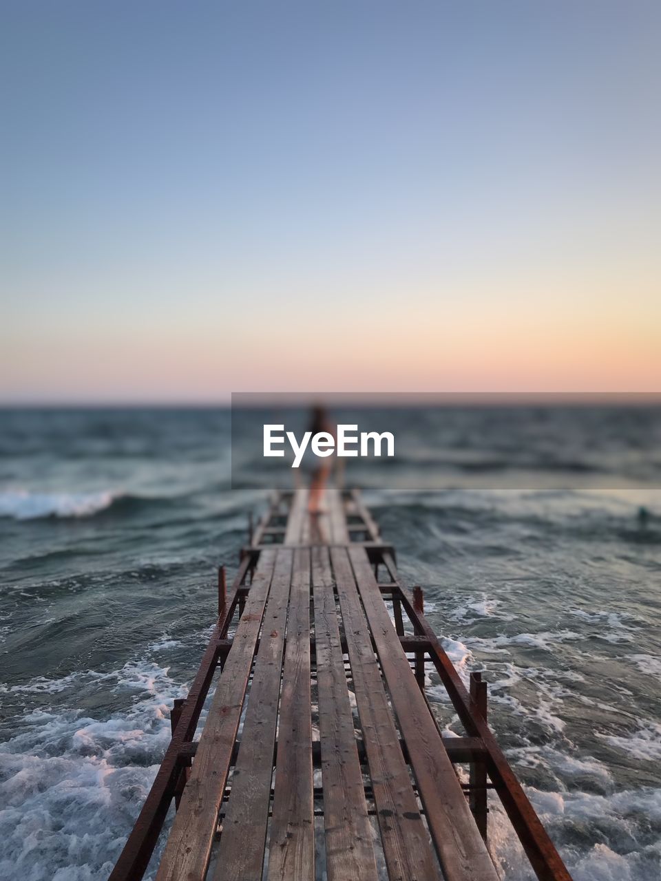 PIER OVER SEA AGAINST SKY