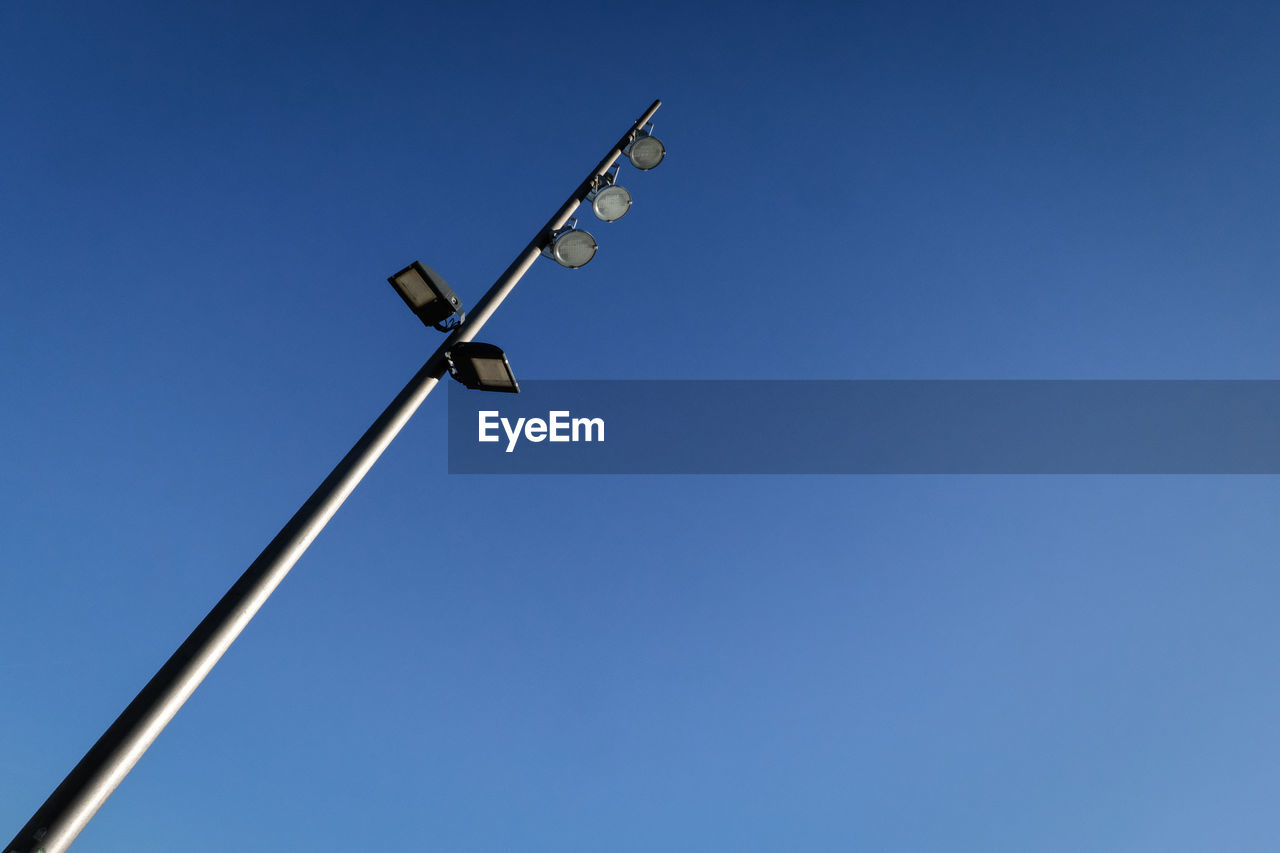 Low angle view of street light against clear sky