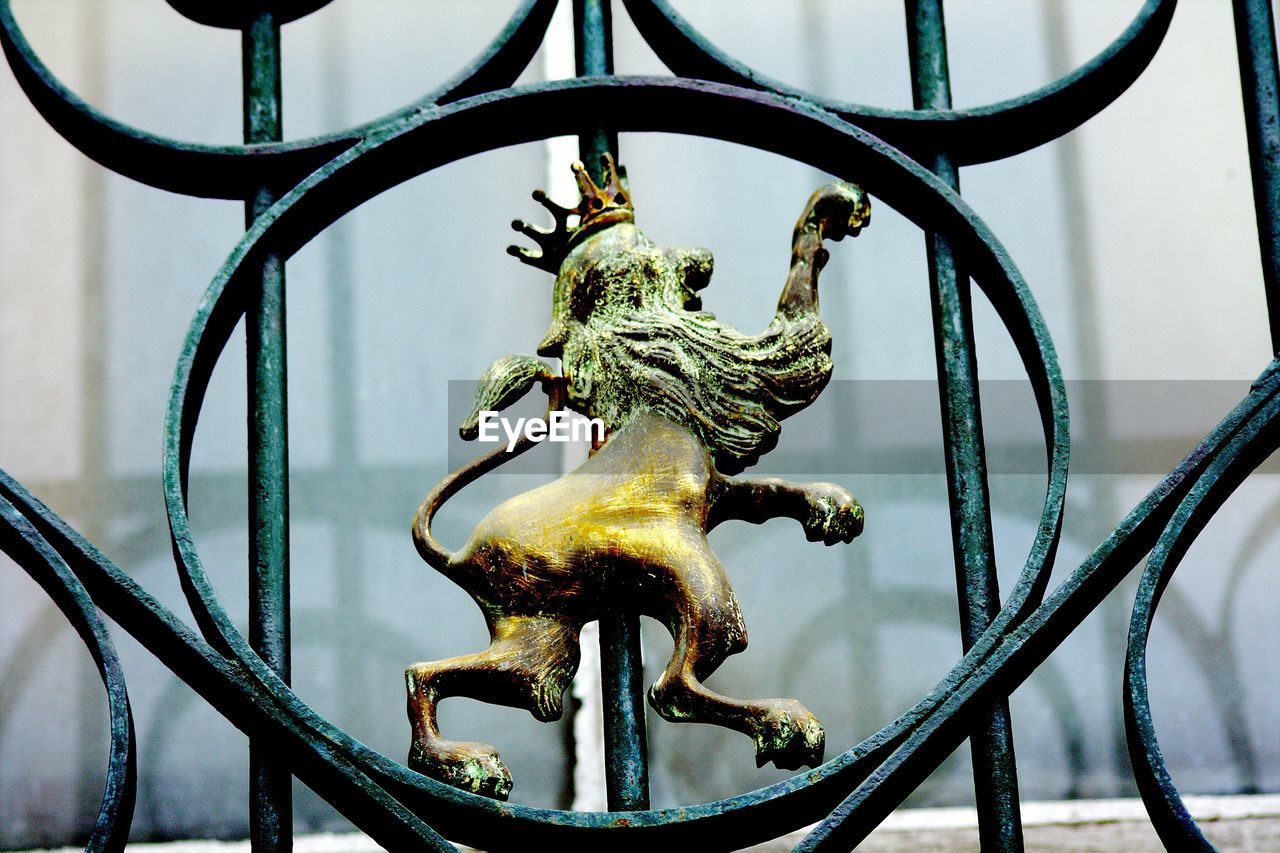 Low angle view of statue on gate