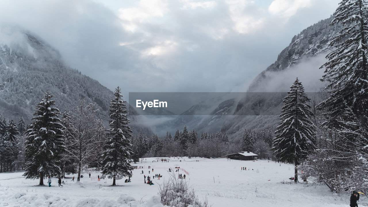 SNOW COVERED LAND AGAINST SKY