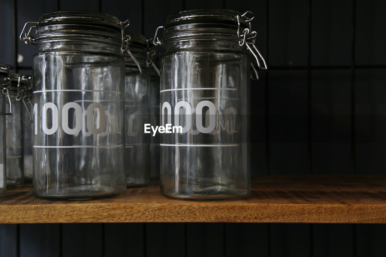 Close-up of glass jars on table