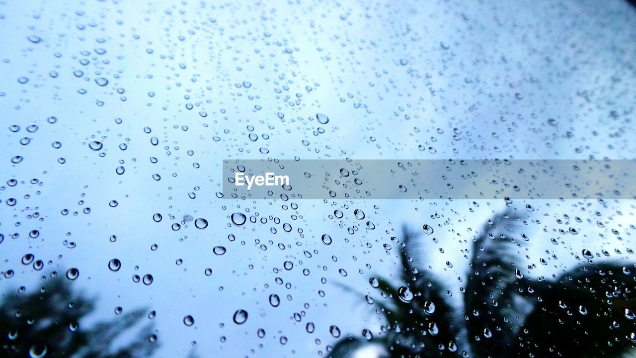 Close-up of water drops on glass