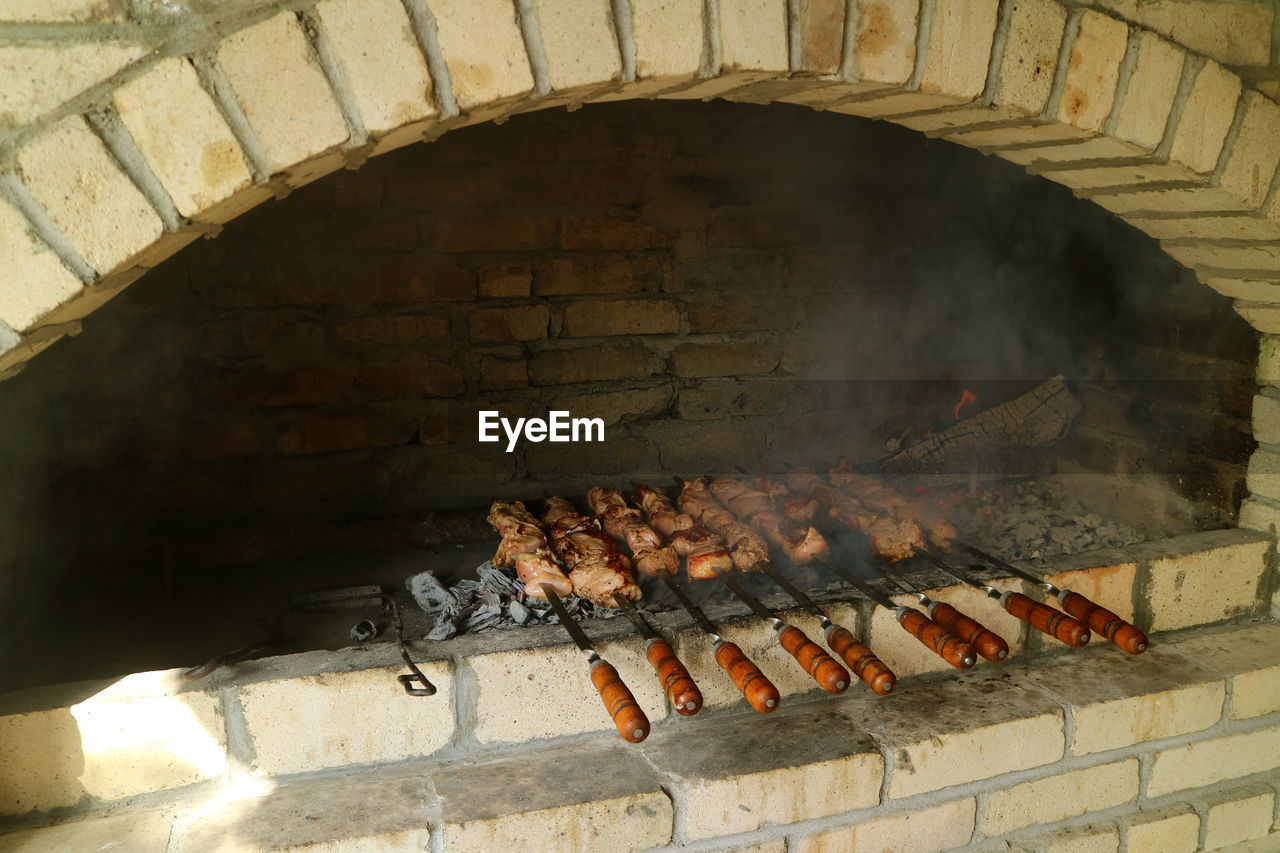 HIGH ANGLE VIEW OF MEAT ON BARBECUE