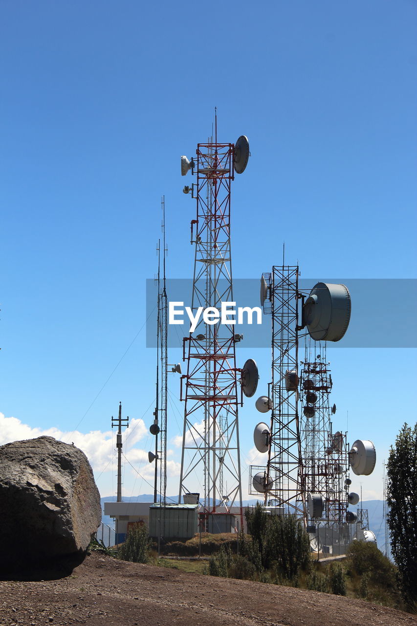 LOW ANGLE VIEW OF TELEPHONE POLE AGAINST CLEAR SKY