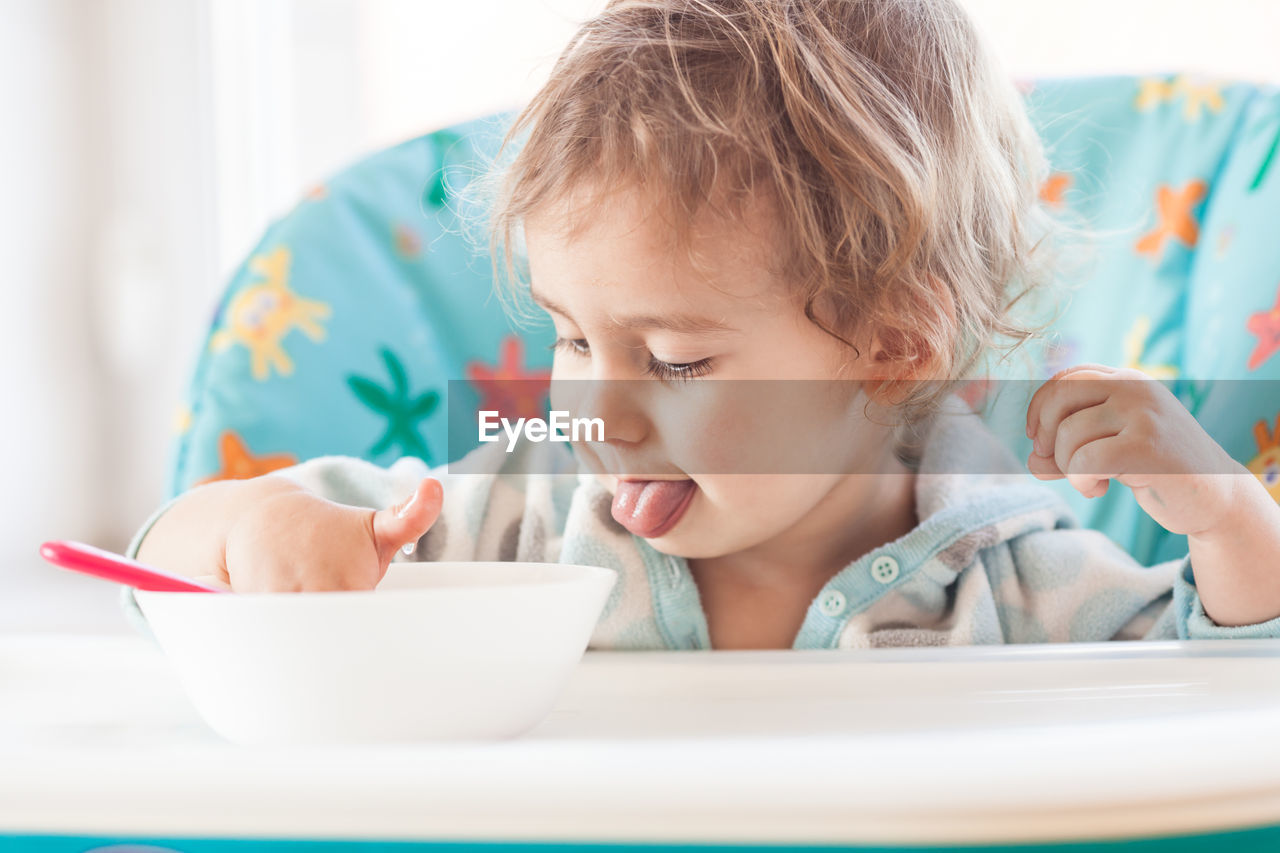 Portrait of cute boy eating food