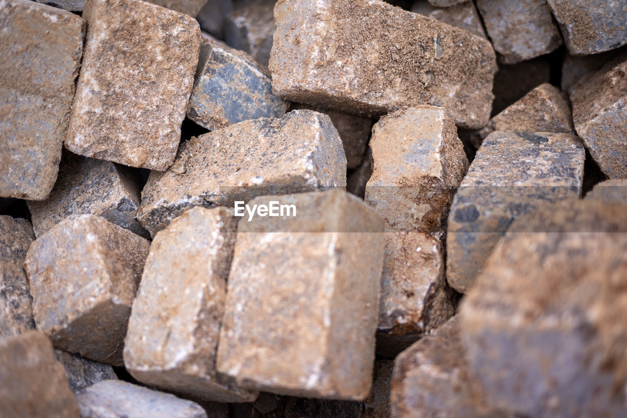 backgrounds, full frame, brick, rock, soil, stone wall, rubble, large group of objects, no people, wall, iron, wood, abundance, close-up, nature, outdoors, day, stone, textured, cobblestone