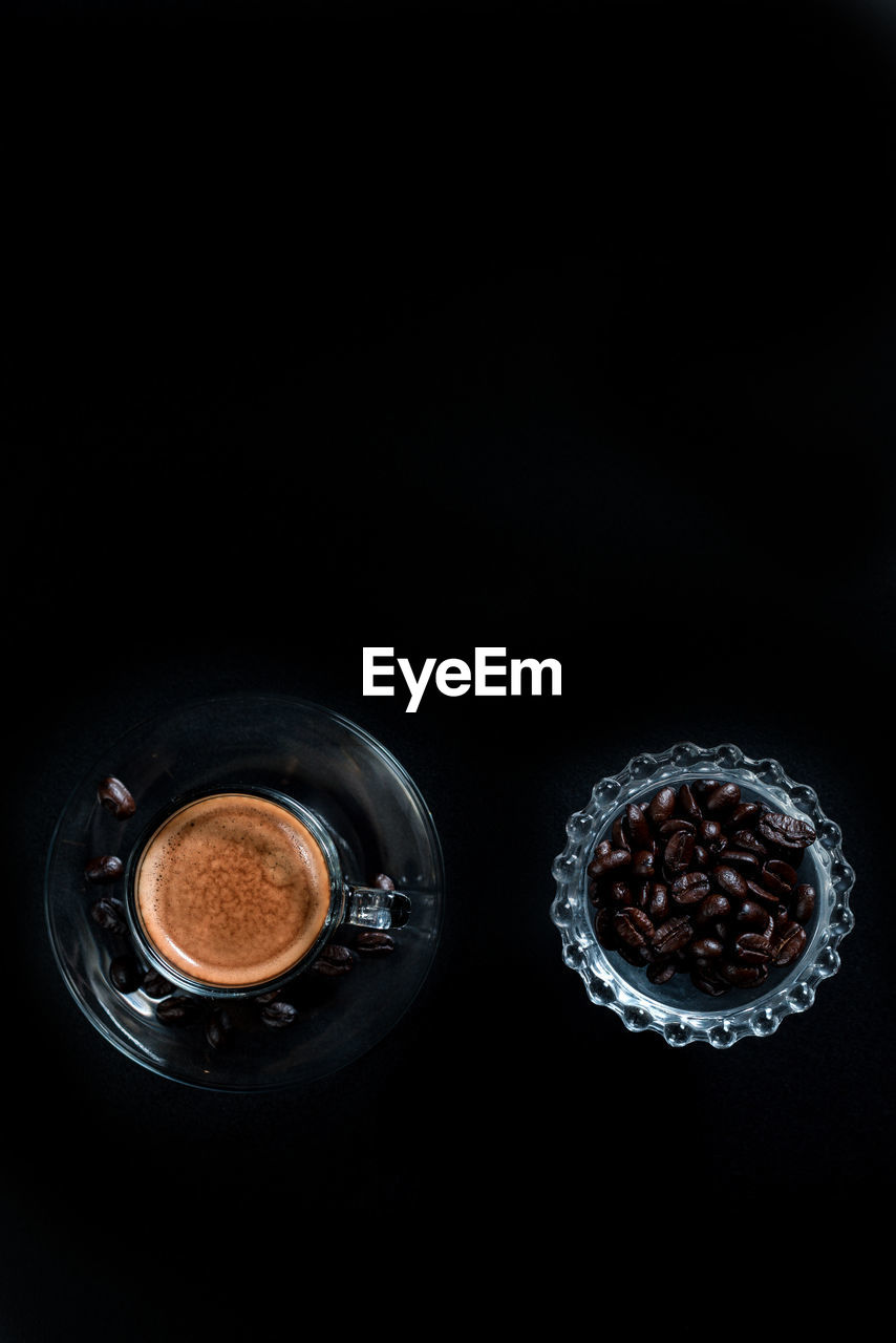 DIRECTLY ABOVE SHOT OF COFFEE CUP ON TABLE