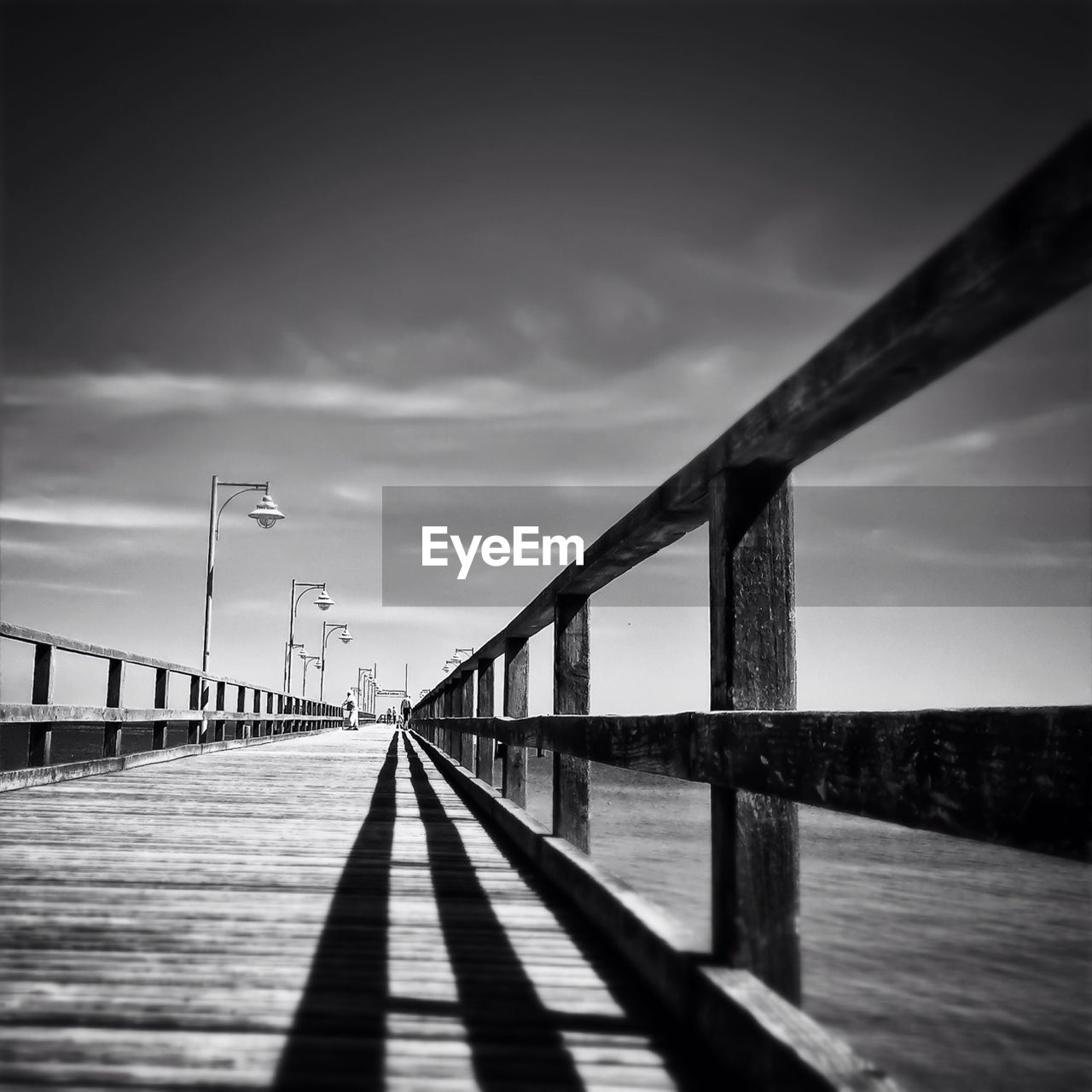 Pier over sea against sky