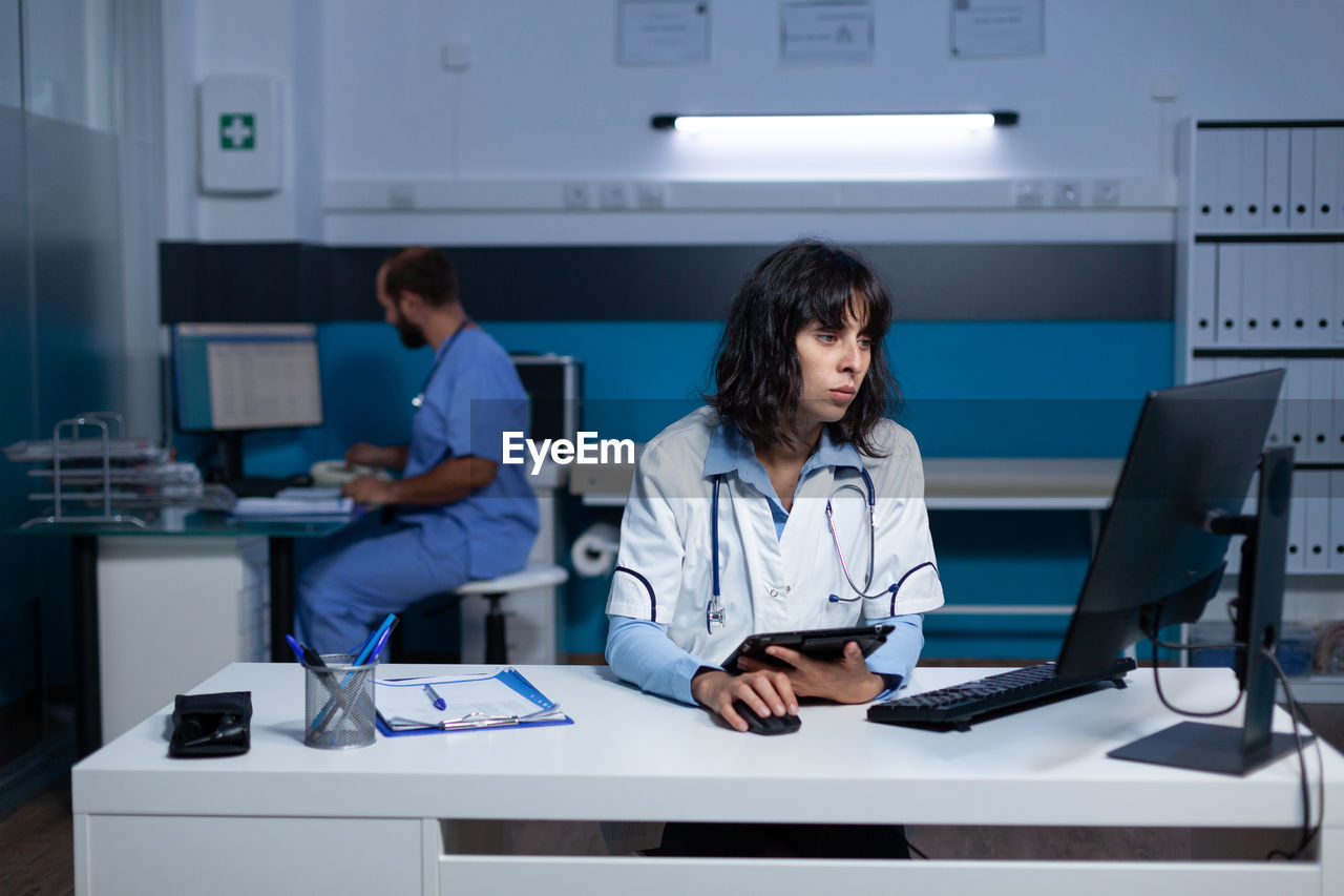 Doctor and nurse working late in hospital