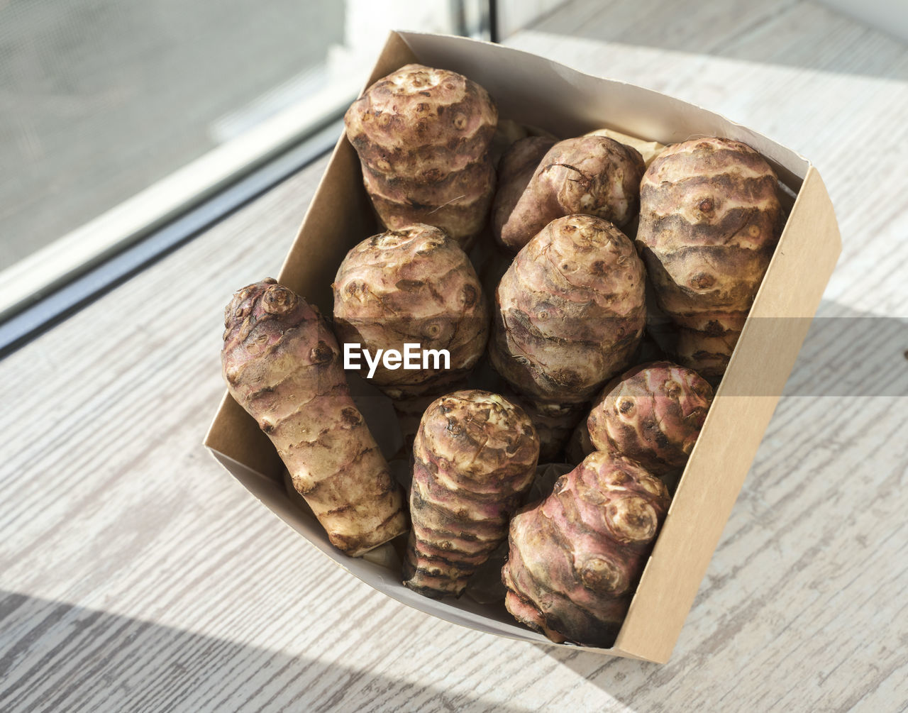 food and drink, food, freshness, table, produce, still life, walnut, wellbeing, healthy eating, indoors, wood, no people, high angle view, close-up, nut, nut - food, container, large group of objects, chocolate, nuts & seeds, day