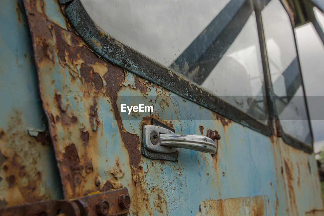 CLOSE-UP OF OLD RUSTY DOOR