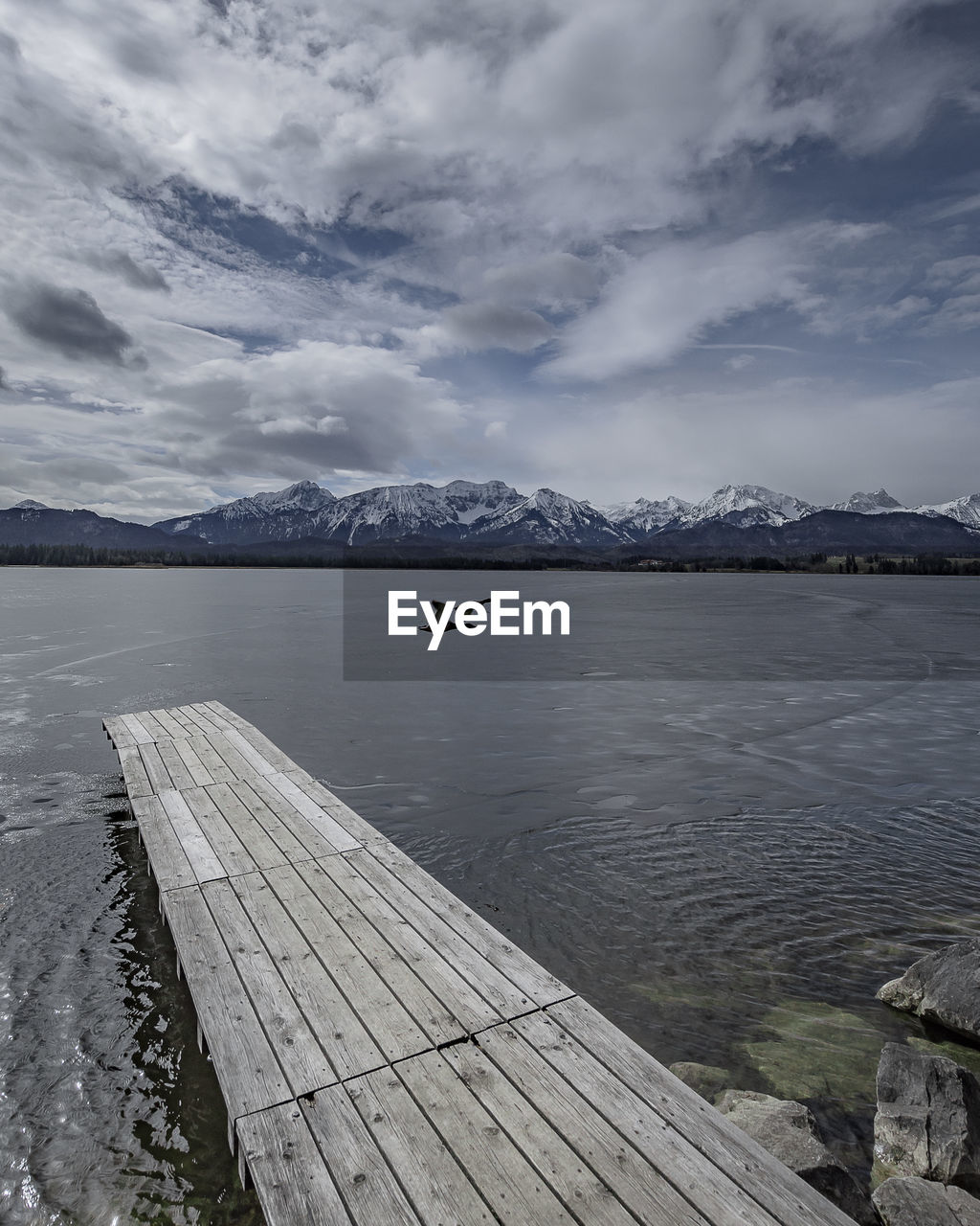 Pier over lake against sky