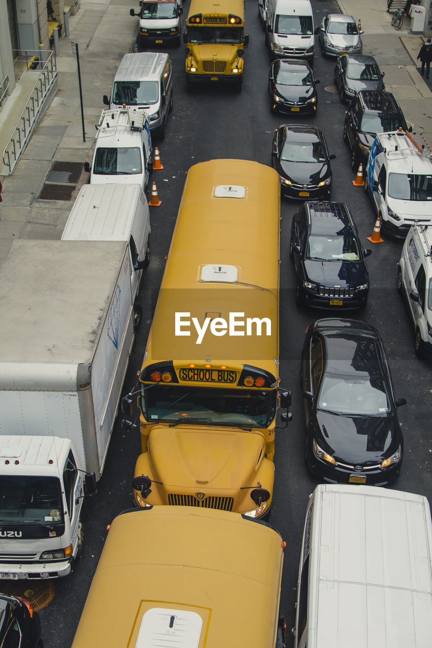 HIGH ANGLE VIEW OF YELLOW CARS ON CAR